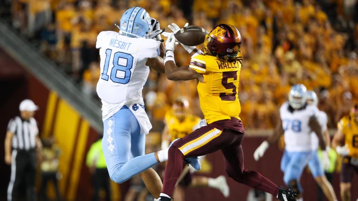 Minnesota defensive back Justin Walley (5) intercepts a pass intended for North Carolina tight end Bryson Nesbit (18) during the first half at Huntington Bank Stadium in Minneapolis on Aug. 29, 2024. 