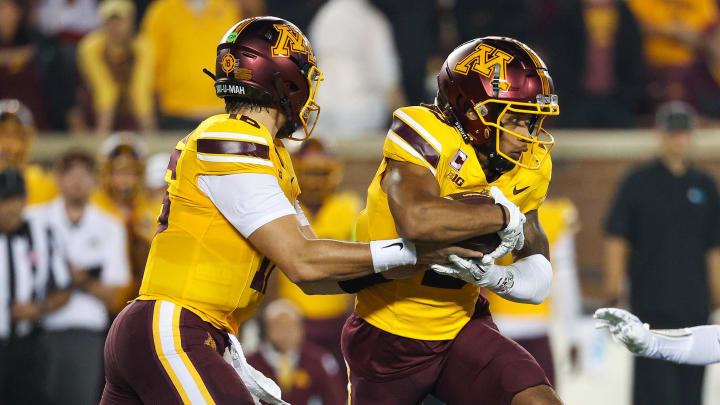 Aug 29, 2024; Minneapolis, Minnesota, USA; Minnesota Golden Gophers quarterback Max Brosmer (16) hands the ball off to wide receiver Daniel Jackson (9) during the first half against the North Carolina Tar Heels at Huntington Bank Stadium. Mandatory Credit: Matt Krohn-USA TODAY Sports