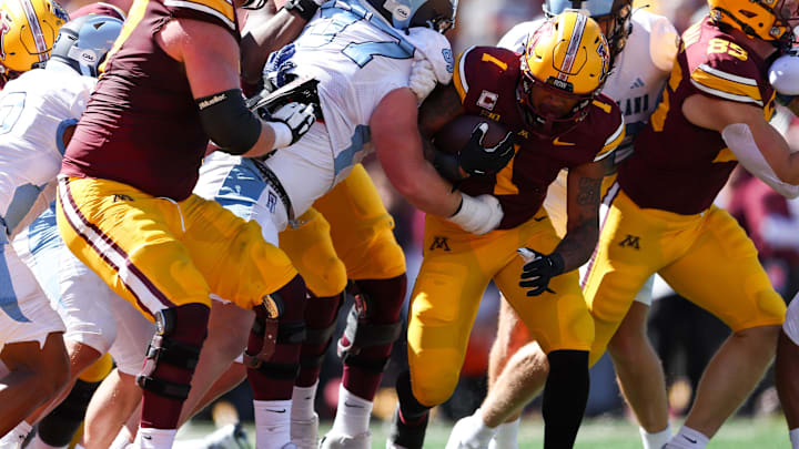 Sep 7, 2024; Minneapolis, Minnesota, USA; Minnesota Golden Gophers running back Darius Taylor (1) runs for a touchdown against the Rhode Island Rams during the first half at Huntington Bank Stadium. Mandatory Credit: Matt Krohn-Imagn Images