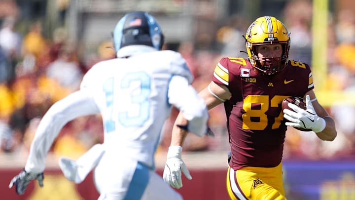 Sep 7, 2024; Minneapolis, Minnesota, USA; Minnesota Golden Gophers tight end Nick Kallerup (87) runs with the ball after making a catch against the Rhode Island Rams during the first half at Huntington Bank Stadium. Mandatory Credit: Matt Krohn-Imagn Images