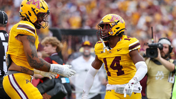 Sep 14, 2024; Minneapolis, Minnesota, USA; Minnesota Golden Gophers defensive back Kerry Brown (14) celebrates his interception against the Nevada Wolf Pack during the first half at Huntington Bank Stadium. Mandatory Credit: Matt Krohn-Imagn Images