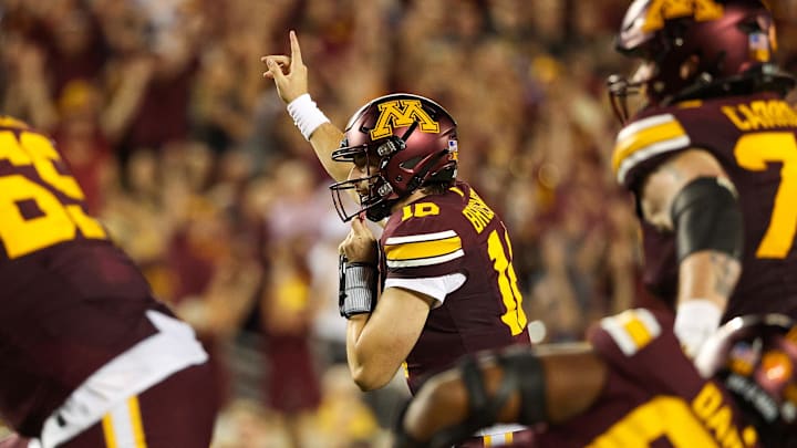 Sep 21, 2024; Minneapolis, Minnesota, USA; Minnesota Golden Gophers quarterback Max Brosmer (16) celebrates his touchdown pass to tight end Jameson Geers (86) during the first half against the Iowa Hawkeyes at Huntington Bank Stadium. Mandatory Credit: Matt Krohn-Imagn Images Sep 21, 2024; Minneapolis, Minnesota, USA; Minnesota Golden Gophers quarterback Max Brosmer (16) celebrates his touchdown pass to tight end Jameson Geers (86) during the first half against the Iowa Hawkeyes at Huntington Bank Stadium. Mandatory Credit: Matt Krohn-Imagn Images