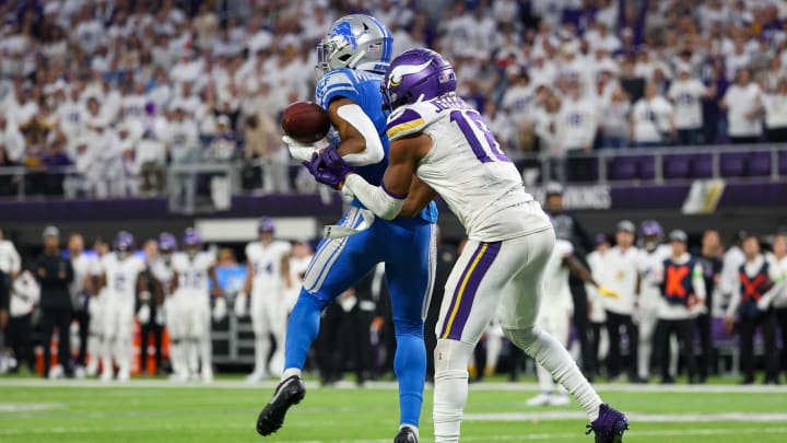 Dec 24, 2023; Minneapolis, Minnesota, USA; Detroit Lions safety Ifeatu Melifonwu (6) intercepts a pass intended for Minnesota Vikings wide receiver Justin Jefferson (18) during the fourth quarter at U.S. Bank Stadium. Mandatory Credit: Matt Krohn-USA TODAY Sports