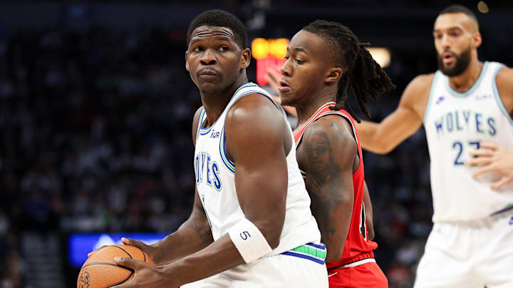 Mar 31, 2024; Minneapolis, Minnesota, USA; Minnesota Timberwolves guard Anthony Edwards (5) works around Chicago Bulls guard Ayo Dosunmu (12) during the first half at Target Center. Mandatory Credit: Matt Krohn-Imagn Images