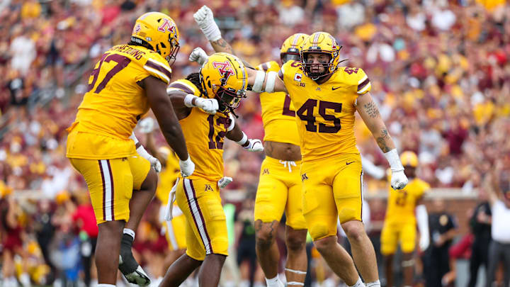 Minnesota Golden Gophers defensive back Darius Green (12) celebrates his tackle 