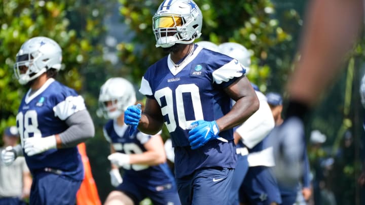 Jun 5, 2024; Frisco, TX, USA;  Dallas Cowboys defensive end DeMarcus Lawrence (90) goes through a drill during practice at the Ford Center at the Star Training Facility in Frisco, Texas. Mandatory Credit: Chris Jones-USA TODAY Sports