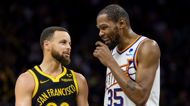 Feb 10, 2024; San Francisco, California, USA; Golden State Warriors guard Stephen Curry (30) and Phoenix Suns forward Kevin Durant (35) talk during the second half at Chase Center. Mandatory Credit: John Hefti-USA TODAY Sports