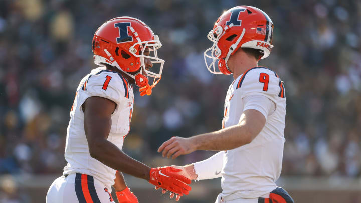 Nov 4, 2023; Minneapolis, Minnesota, USA; Illinois Fighting Illini wide receiver Isaiah Williams (1) celebrates his touchdown with quarterback Luke Altmyer (9) during the first half against the Minnesota Golden Gophers at Huntington Bank Stadium. Mandatory Credit: Matt Krohn-USA TODAY Sports