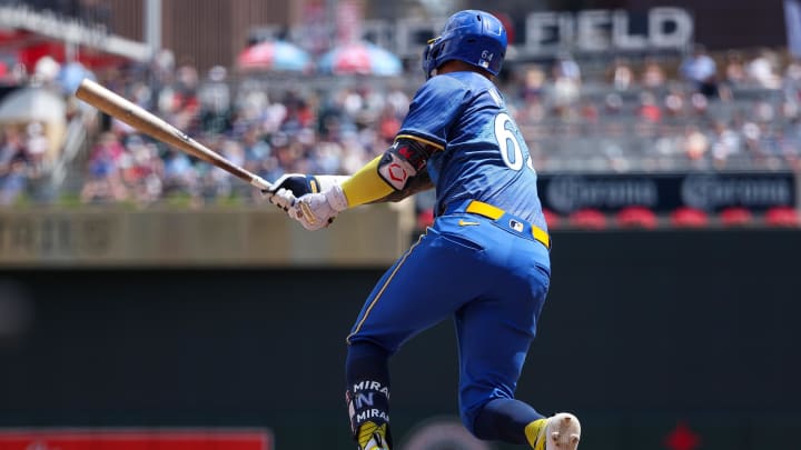 Minnesota Twins third baseman Jose Miranda (64) hits a single against the Houston Astros setting the longest streak in the MLB expansion era with hits in 12 straight at bats during the fourth inning at Target Field in Minneapolis on July 6, 2024. 