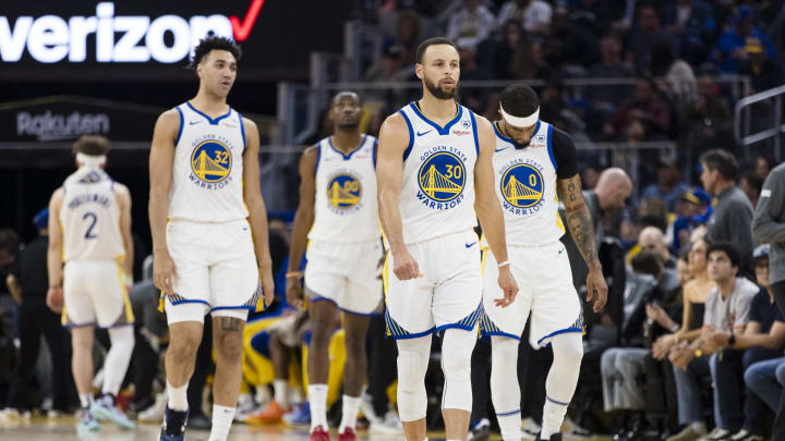 Golden State Warriors guard Stephen Curry (30) and guard Brandin Podziemski (2) and other players walk on the court after a time-out during the first half of the game against the New York Knicks at Chase Center. Mandatory Credit: