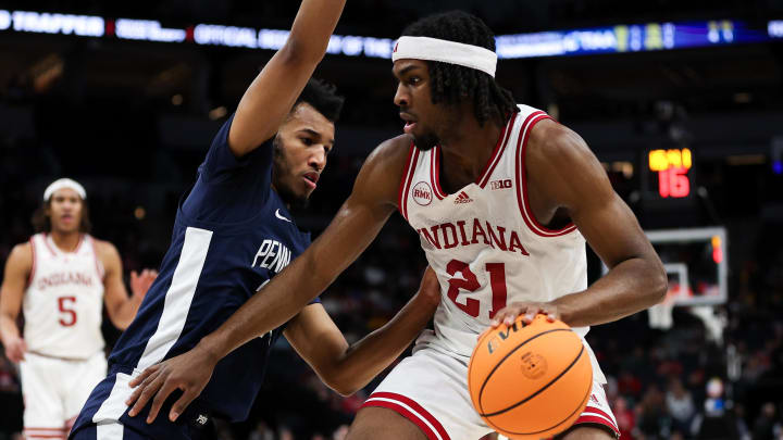 Mar 14, 2024; Minneapolis, MN, USA; Indiana Hoosiers forward Mackenzie Mgbako (21) dribbles as Penn State Nittany Lions forward Zach Hicks (24) defends during the first half at Target Center. Mandatory Credit: Matt Krohn-USA TODAY Sports