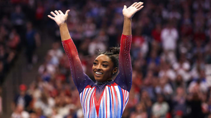 Jun 30, 2024; Minneapolis, Minnesota, USA; Simone Biles celebrates her floor routine during the U.S. Olympic Team Gymnastics Trials at Target Center. Mandatory Credit: Matt Krohn-USA TODAY Sports