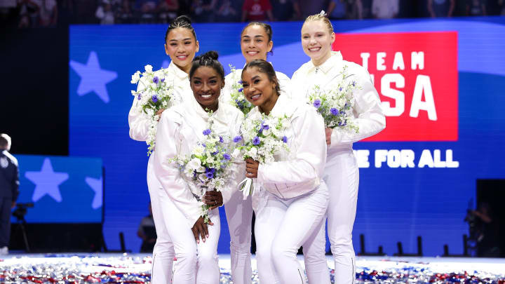 Jun 30, 2024; Minneapolis, Minnesota, USA; Sunisa Lee, Hezly Rivera, Jade Carey, Simone Biles and Jordan Chiles pose for a photo after being selected for the 2024 U.S. Olympic Women's gymnastics team during the U.S. Olympic Team Gymnastics Trials at Target Center.