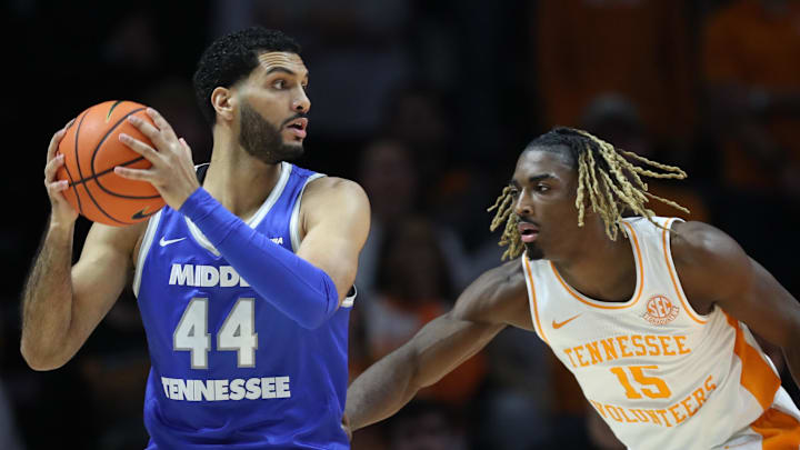 Dec 23, 2024; Knoxville, Tennessee, USA; Middle Tennessee Blue Raiders forward Essam Mostafa (44) moves the ball against Tennessee Volunteers guard Jahmai Mashack (15) during the first half at Thompson-Boling Arena at Food City Center. Mandatory Credit: Randy Sartin-Imagn Images
