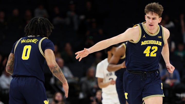 Mar 13, 2024; Minneapolis, MN, USA; Michigan Wolverines forward Will Tschetter (42) celebrates his basket against the Penn State Nittany Lions during the second half at Target Center. Mandatory Credit: Matt Krohn-USA TODAY Sports