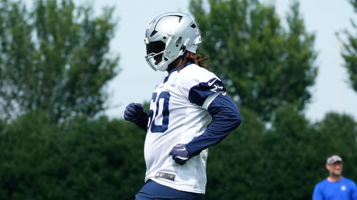 Jun 5, 2024; Frisco, TX, USA; Dallas Cowboys tackle Tyler Guyton (60) goes through a drill during practice at the Ford Center at the Star Training Facility in Frisco, Texas.