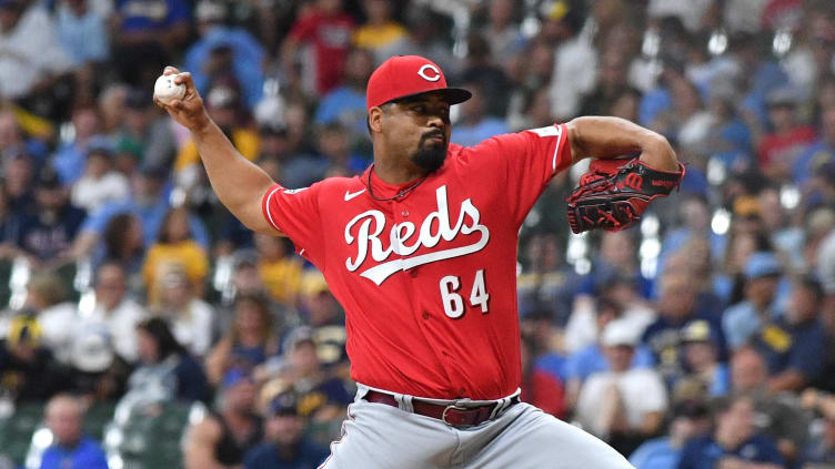 Cincinnati Reds relief pitcher Tony Santillan (64) delivers a pitch