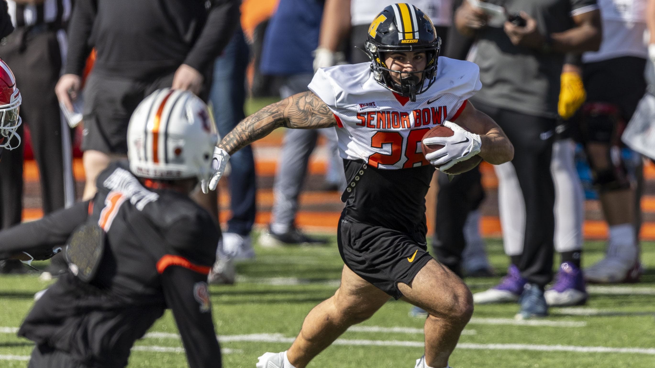 American Team running back Cody Schrader of Missouri (28) runs the ball.