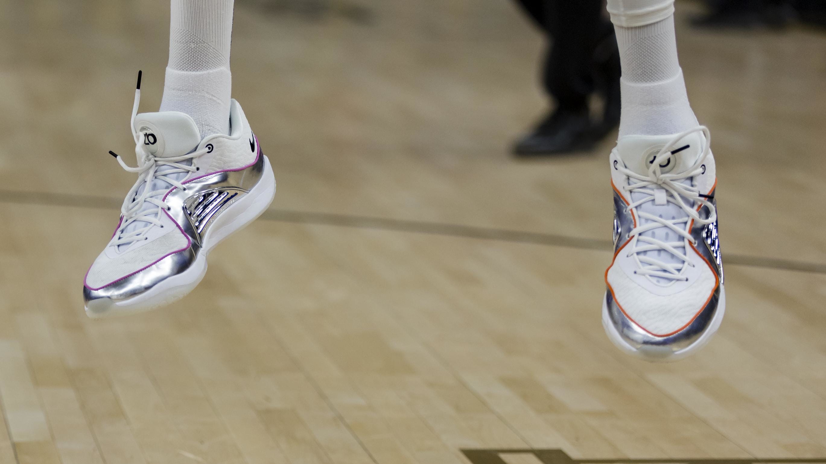 Phoenix Suns forward Kevin Durant wears silver Nike sneakers.