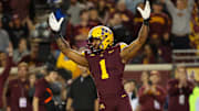 Oct 5, 2024; Minneapolis, Minnesota, USA; Minnesota Golden Gophers running back Darius Taylor (1) celebrates quarterback Max Brosmer's (16) touchdown against the USC Trojans during the first half at Huntington Bank Stadium.