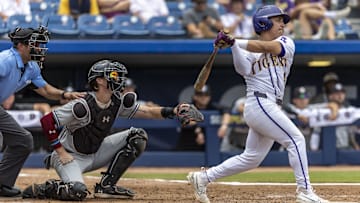 May 25, 2024; Hoover, AL, USA; LSU Tigers infielder Steven Milam (4) hits a leadoff double against the South Carolina Gamecocks during the SEC Baseball Tournament at Hoover Metropolitan Stadium. Mandatory Credit: Vasha Hunt-Imagn Images