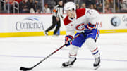 Dec 20, 2024; Detroit, Michigan, USA; Montreal Canadiens center Jake Evans (71) handles the puck during the first period against the Detroit Red Wings at Little Caesars Arena. Mandatory Credit: Brian Bradshaw Sevald-Imagn Images