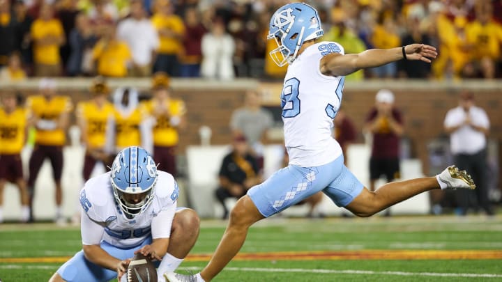 Aug 29, 2024; Minneapolis, Minnesota, USA; North Carolina Tar Heels place kicker Noah Burnette (98) kicks a field goal against the Minnesota Golden Gophers during the second half at Huntington Bank Stadium. Mandatory Credit: Matt Krohn-USA TODAY Sports