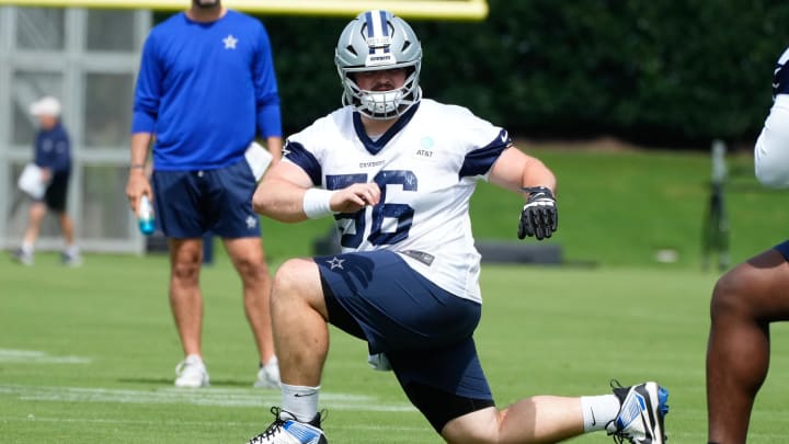 Jun 5, 2024; Frisco, TX, USA;  Dallas Cowboys center Cooper Beebe (56) goes through a drill during practice at the Ford Center at the Star Training Facility in Frisco, Texas. Mandatory Credit: Chris Jones-USA TODAY Sports