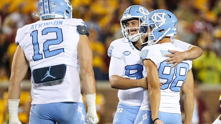 Aug 29, 2024; Minneapolis, Minnesota, USA; North Carolina Tar Heels place kicker Noah Burnette (98) and punter Tom Maginness (96) celebrate during the second half against the Minnesota Golden Gophers at Huntington Bank Stadium. Mandatory Credit: Matt Krohn-Imagn Images