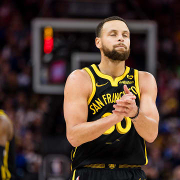 Feb 14, 2024; San Francisco, California, USA; Golden State Warriors guard Stephen Curry (30) reacts after missing a shot against the LA Clippers during the second half at Chase Center. 