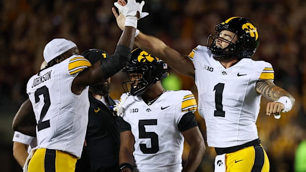 Sep 21, 2024; Minneapolis, Minnesota, USA; Iowa Hawkeyes quarterback Brendan Sullivan (1) celebrates his rushing touchdown wi