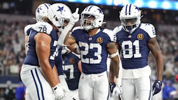 Dallas Cowboys running back Rico Dowdle (23) celebrates with teammates after scoring a touchdown against the New York Giants during the second half at AT&T Stadium.