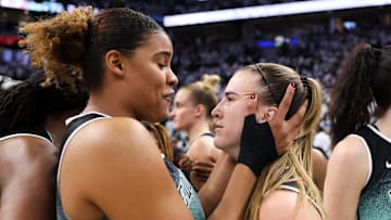 Oct 16, 2024; Minneapolis, Minnesota, USA; New York Liberty guard Sabrina Ionescu (20) celebrates her team's win forward Nyara Sabally (8) after game three of the 2024 NBA Finals against the Minnesota Lynx at Target Center