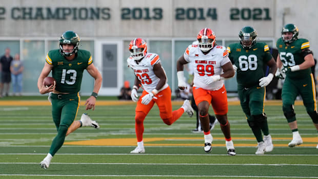 Baylor Bears quarterback Sawyer Robertson (13) runs the ball against Oklahoma State Cowboys nose tackle Iman Oates (99)