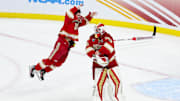 Apr 13, 2024; Saint Paul, Minnesota, USA; Denver Pioneers defenseman Zeev Buium (28) and goaltender Matt Davis (35) celebrate their teams win against the Boston College Eagles after the championship game of the 2024 Frozen Four college ice hockey tournament at Xcel Energy Center. Mandatory Credit: Matt Krohn-Imagn Images