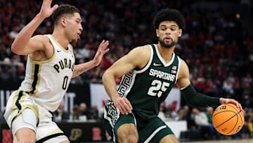 Mar 15, 2024; Minneapolis, MN, USA; Michigan State Spartans forward Malik Hall (25) works around Purdue Boilermakers forward Mason Gillis (0) during the second half at Target Center. Mandatory Credit: Matt Krohn-Imagn Images