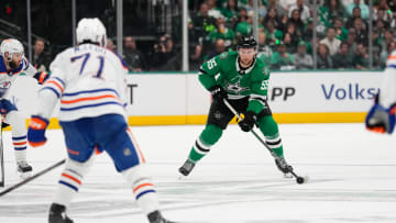 May 31, 2024; Dallas, Texas, USA; Dallas Stars defenseman Thomas Harley (55) looks to pass against Edmonton Oilers center Ryan McLeod (71) during the second period between the Dallas Stars and the Edmonton Oilers in game five of the Western Conference Final of the 2024 Stanley Cup Playoffs at American Airlines Center. Mandatory Credit: Chris Jones-USA TODAY Sports