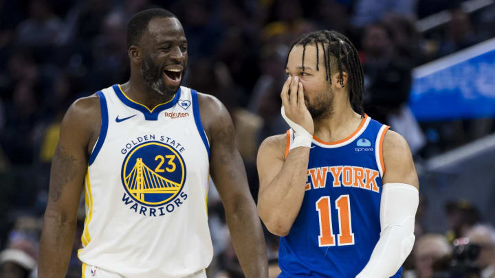 Mar 18, 2024; San Francisco, California, USA; Golden State Warriors center Draymond Green (23) and New York Knicks guard Jalen Brunson (11) share a laugh during the first half at Chase Center. Mandatory Credit: