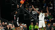 Jan 7, 2025; Waco, Texas, USA;  Cincinnati Bearcats guard Day Day Thomas (1) scores a three-point basket against Baylor Bears guard VJ Edgecombe (7) during the first half at Paul and Alejandra Foster Pavilion. Mandatory Credit: Chris Jones-Imagn Images