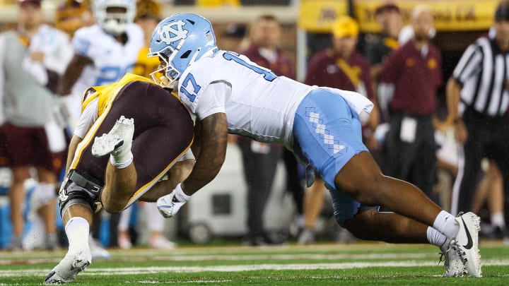 Aug 29, 2024; Minneapolis, Minnesota, USA; North Carolina Tar Heels linebacker Amare Campbell (17) forces a fumble on Minnesota Golden Gophers quarterback Max Brosmer (16) during the second half at Huntington Bank Stadium. Mandatory Credit: Matt Krohn-USA TODAY Sports