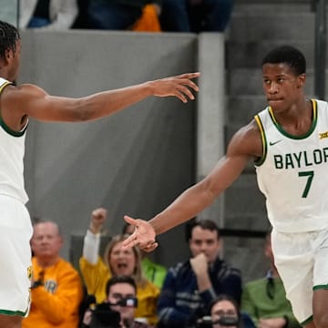 Jan 19, 2025; Waco, Texas, USA;  Baylor Bears guard VJ Edgecombe (7) celebrates with Baylor Bears guard Jeremy Roach (3) after a play against the TCU Horned Frogs during the first half at Paul and Alejandra Foster Pavilion. Mandatory Credit: Chris Jones-Imagn Images