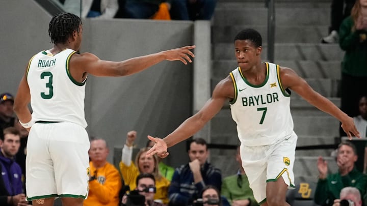 Jan 19, 2025; Waco, Texas, USA; Baylor Bears guard VJ Edgecombe (7) celebrates with Baylor Bears guard Jeremy Roach (3) after a play against the TCU Horned Frogs during the first half at Paul and Alejandra Foster Pavilion. Mandatory Credit: Chris Jones-Imagn Images Jan 19, 2025; Waco, Texas, USA; Baylor Bears guard VJ Edgecombe (7) celebrates with Baylor Bears guard Jeremy Roach (3) after a play against the TCU Horned Frogs during the first half at Paul and Alejandra Foster Pavilion. Mandatory Credit: Chris Jones-Imagn Images