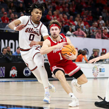 Mar 16, 2024; Minneapolis, MN, USA; Nebraska Cornhuskers guard Sam Hoiberg (1) works around Illinois Fighting Illini guard Terrence Shannon Jr. (0) during the second half at Target Center.