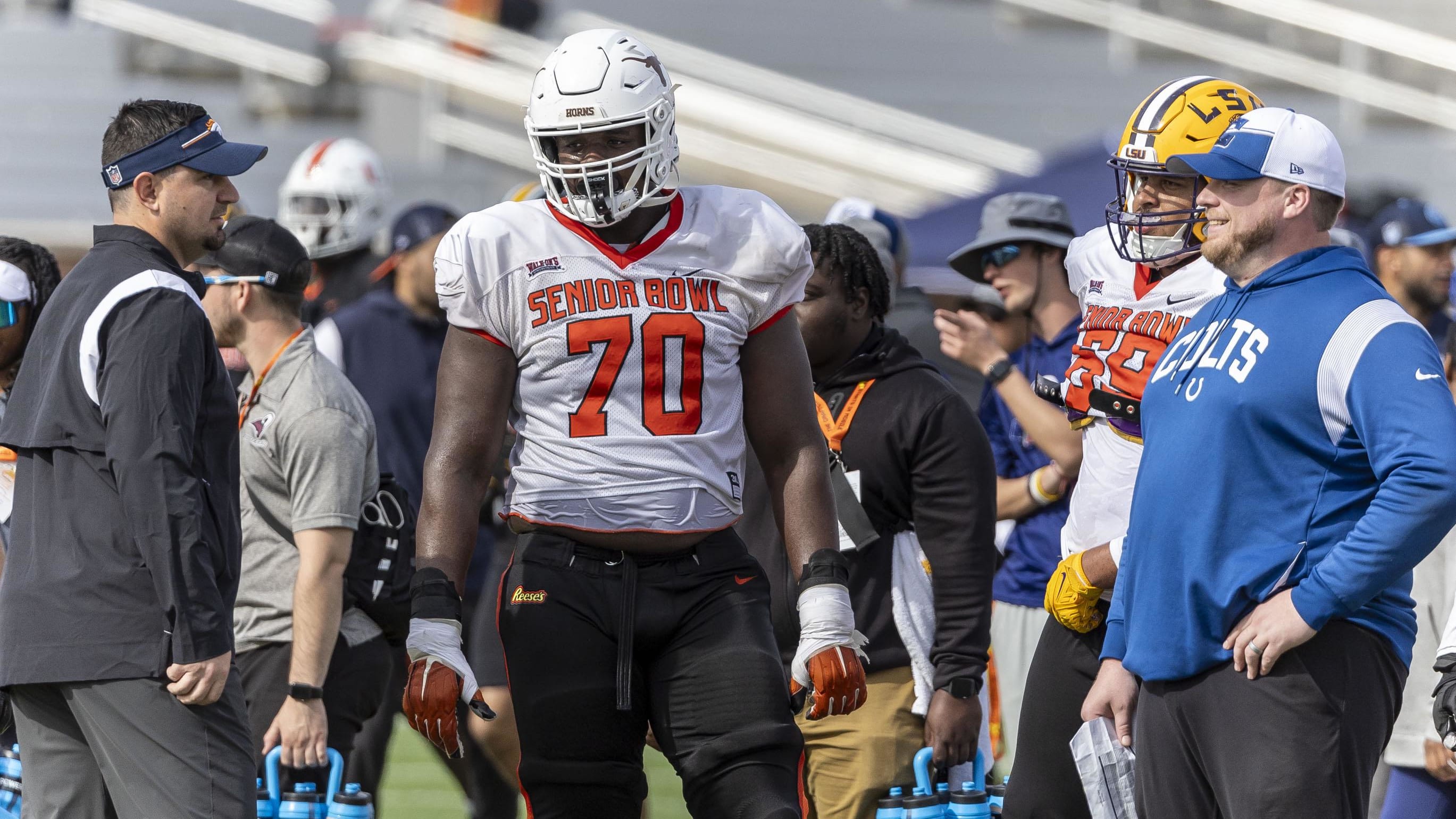 American offensive lineman Christian Jones of Texas (70) talks with coaches at the Senior Bowl.