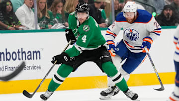 May 31, 2024; Dallas, Texas, USA; Dallas Stars defenseman Miro Heiskanen (4) skates with the puck ahead of Edmonton Oilers right wing Connor Brown (28) during the second period between the Dallas Stars and the Edmonton Oilers in game five of the Western Conference Final of the 2024 Stanley Cup Playoffs at American Airlines Center. Mandatory Credit: Chris Jones-Imagn Images