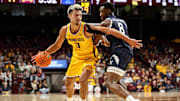 Minnesota forward Dawson Garcia works around Yale forward Isaac Celiscar (8) during the first half at Williams Arena in Minneapolis on Nov. 16, 2024.
