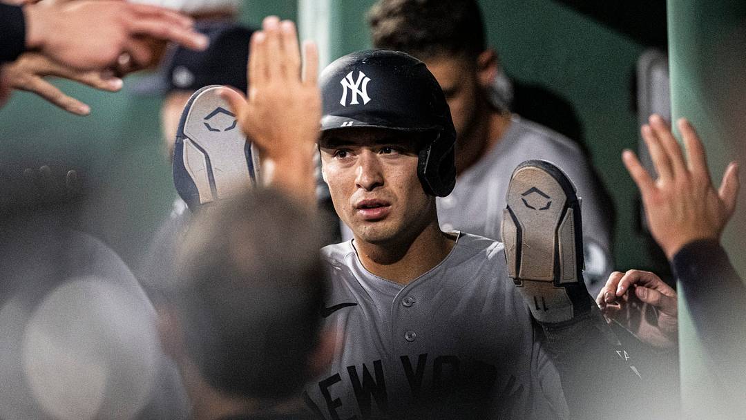 Jun 17, 2026; Boston, Massachusetts, USA; New York Yankees shortstop Anthony Volpe (11) is greeted in the dugout after scoring in the eighth inning against the New York Yankees at Fenway Park. Mandatory Credit: Jaiden Tripi-Imagn Images