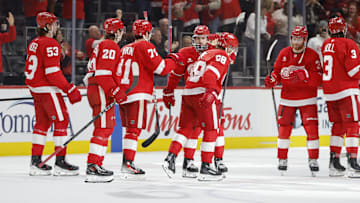 Feb 23, 2025; Detroit, Michigan, USA; The Detroit Red Wings celebrate their win over the Anaheim Ducks at the end of an overtime period at Little Caesars Arena. Mandatory Credit: Brian Bradshaw Sevald-Imagn Images