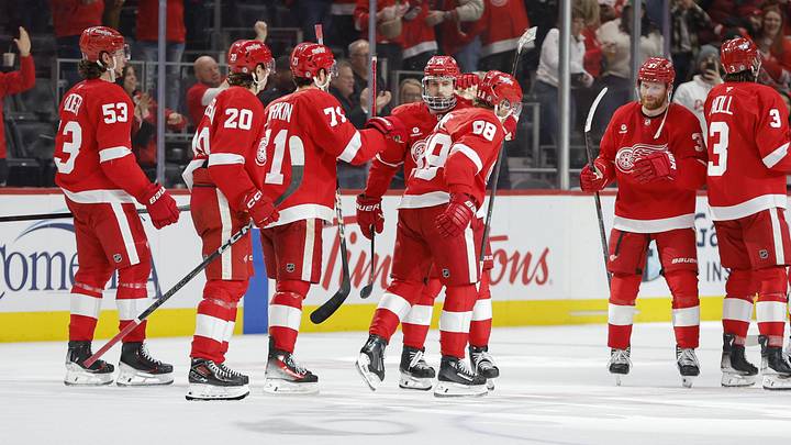 Feb 23, 2025; Detroit, Michigan, USA; The Detroit Red Wings celebrate their win over the Anaheim Ducks at the end of an overtime period at Little Caesars Arena. Mandatory Credit: Brian Bradshaw Sevald-Imagn Images