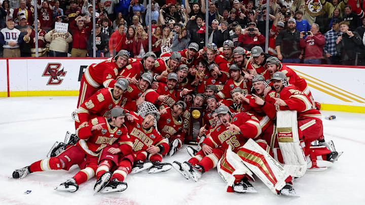Denver Pioneers players pose for a photo after their teams win against the Boston College Eagles after the championship game of the 2024 Frozen Four college ice hockey tournament at Xcel Energy Center. Denver Pioneers players pose for a photo after their teams win against the Boston College Eagles after the championship game of the 2024 Frozen Four college ice hockey tournament at Xcel Energy Center.